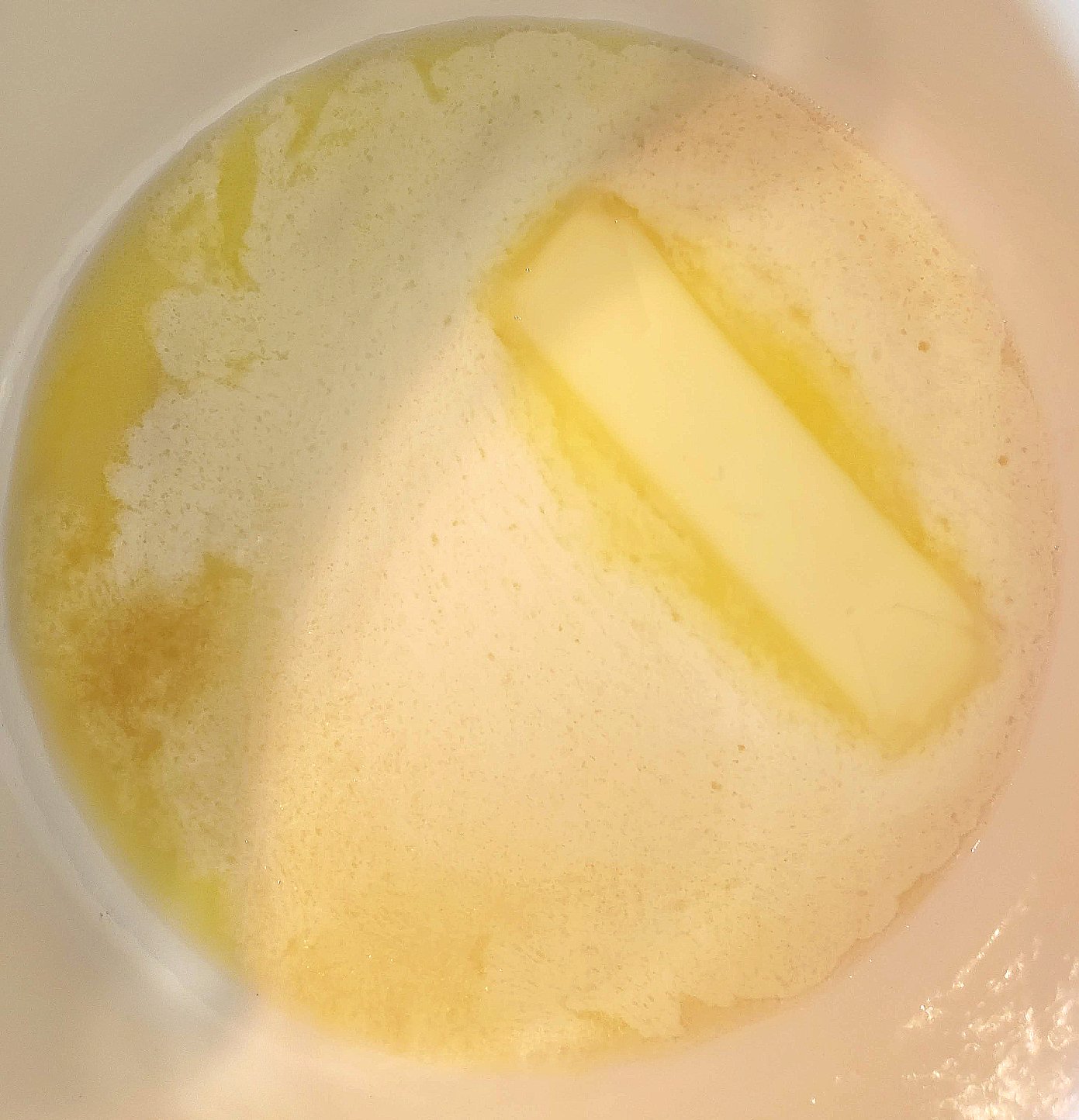 butter starting to melt in a pan