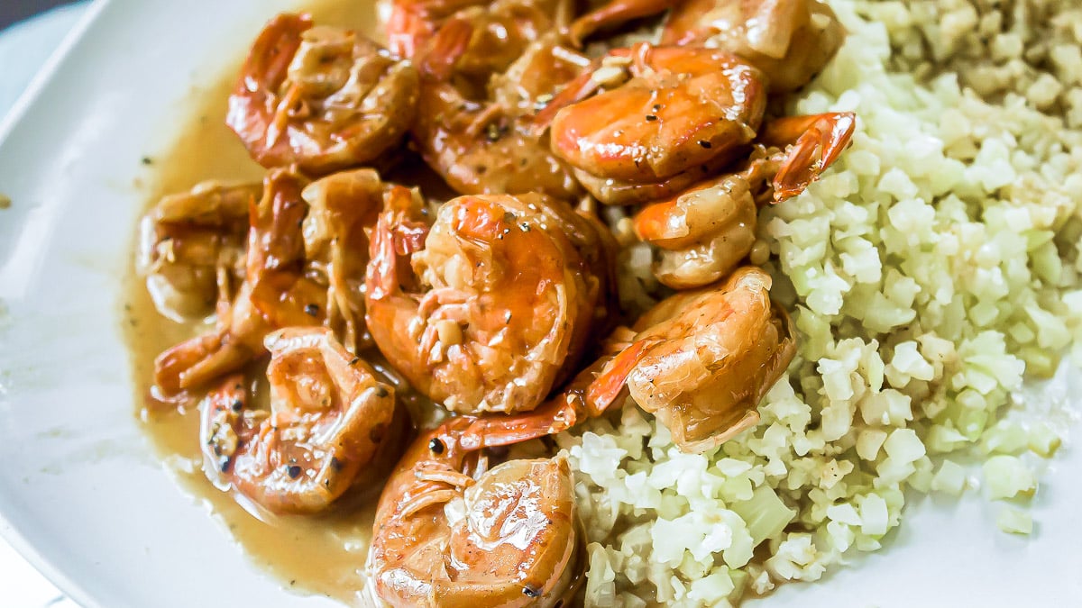 barbecue shrimp recipe on a plate with cauliflower rice