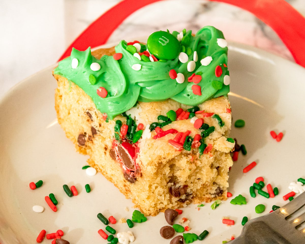 slice of Christmas Cookie cake with a  bite taken out