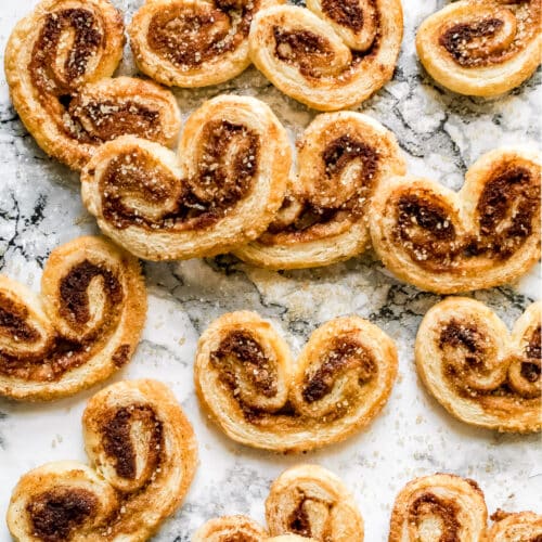 cinnamon palmiers scattered on a counter