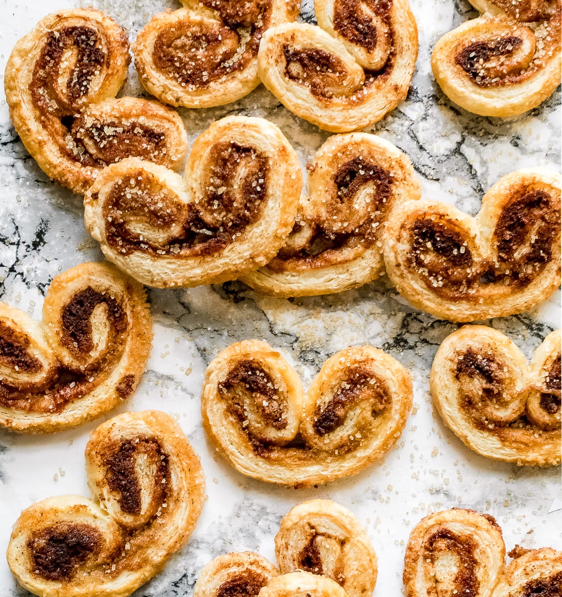 cinnamon palmiers scattered on a counter