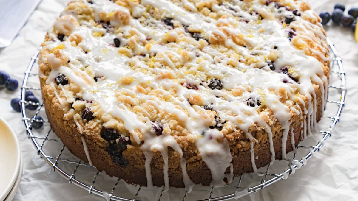 blueberry cream cheese coffee cake on a rack before being cut