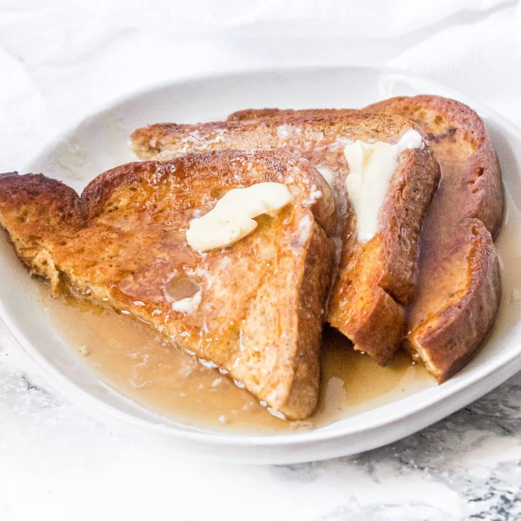 keto french toast on a plate with butter and syrup