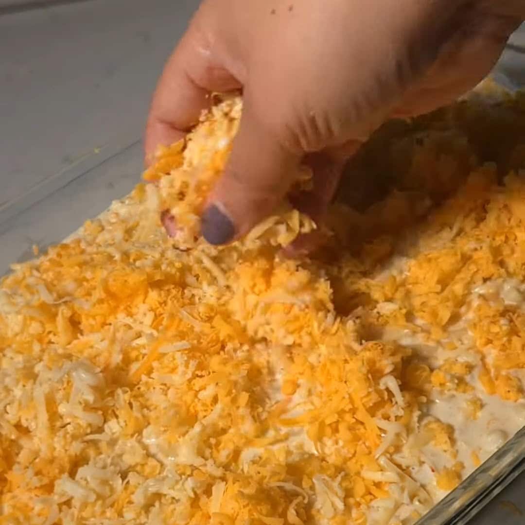 Topping black folks mac and cheese recipe with cheese.