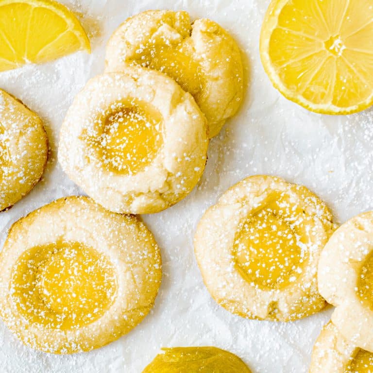 Overhead view of lemon curd cookies on parchment paper