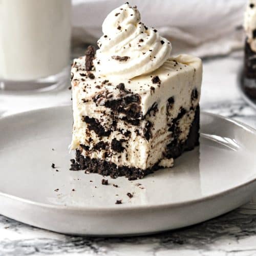 no bake Oreo cheesecake slice with a bite missing