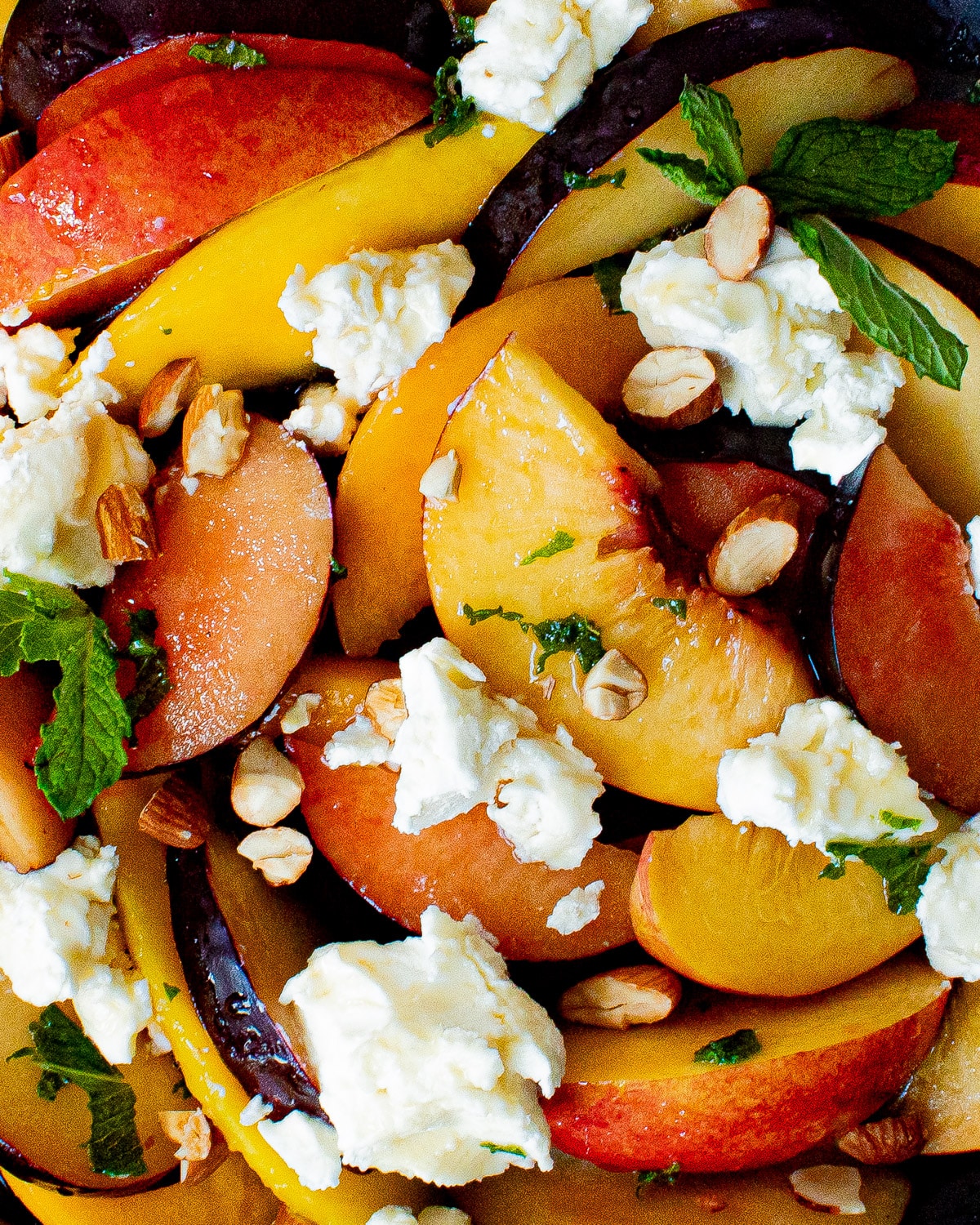 close up of stone fruit salad on a plate