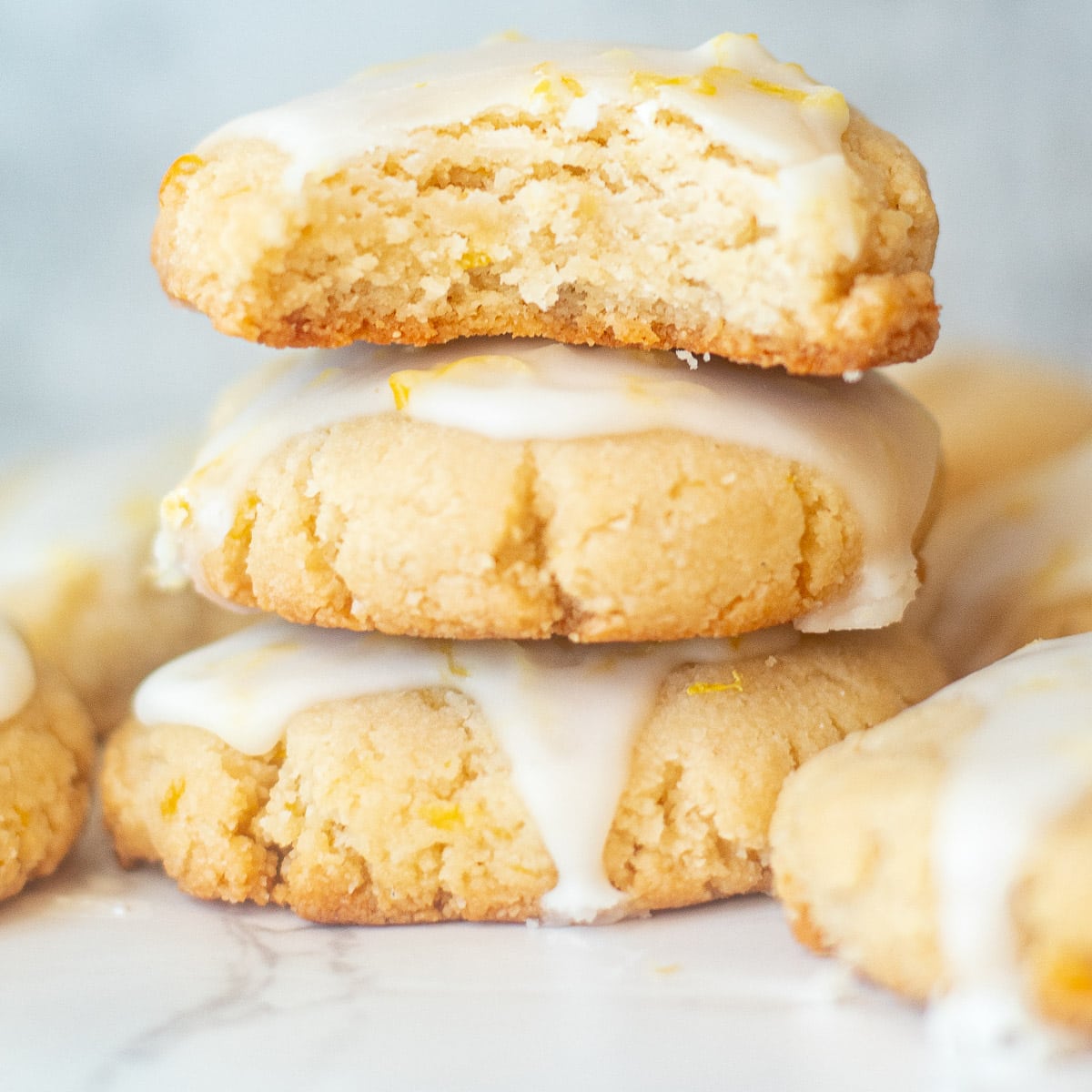 closeup of almond lemon cookies with a bite taken out