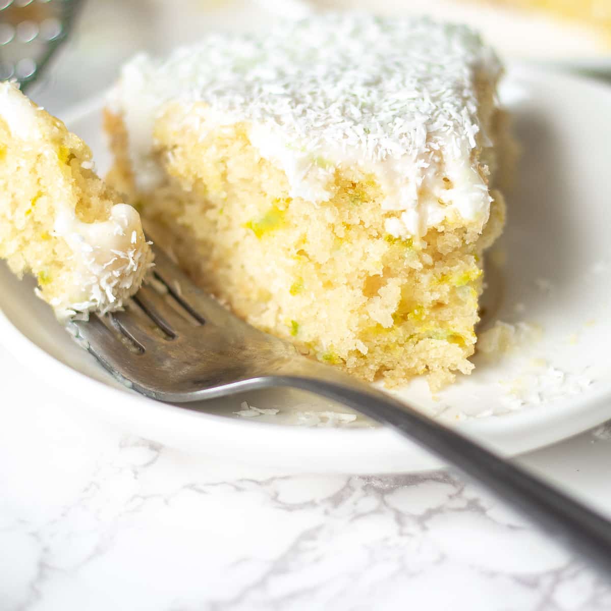 vegan coconut cake with a bite cut out