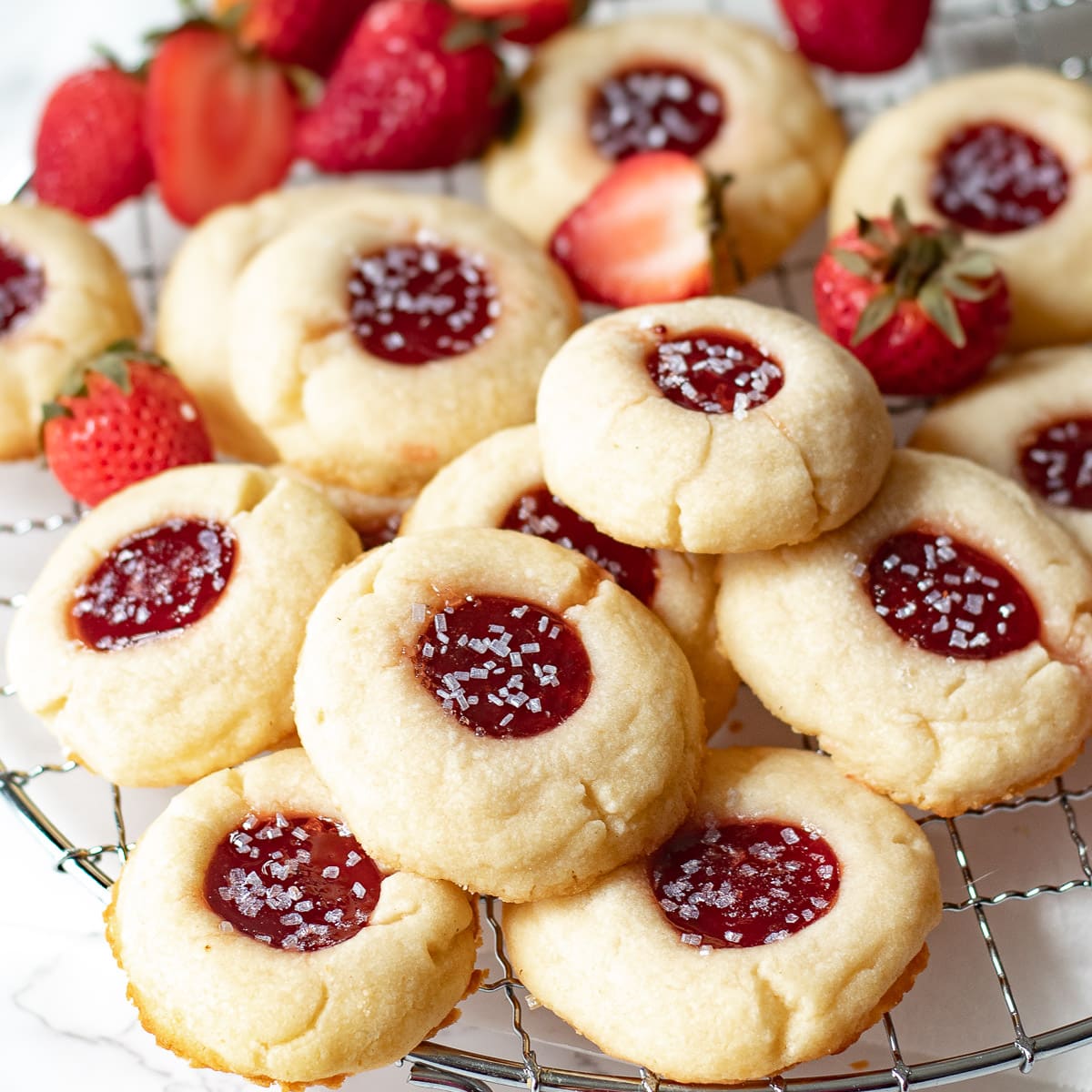 strawberry jam shortbread cookies on a wire rack