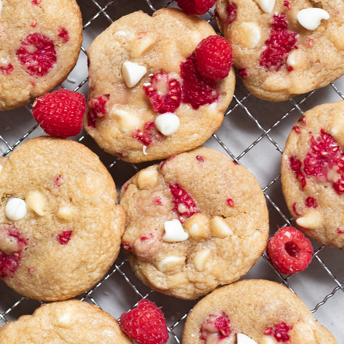 raspberry white chocolate cookies from overhead on a rack