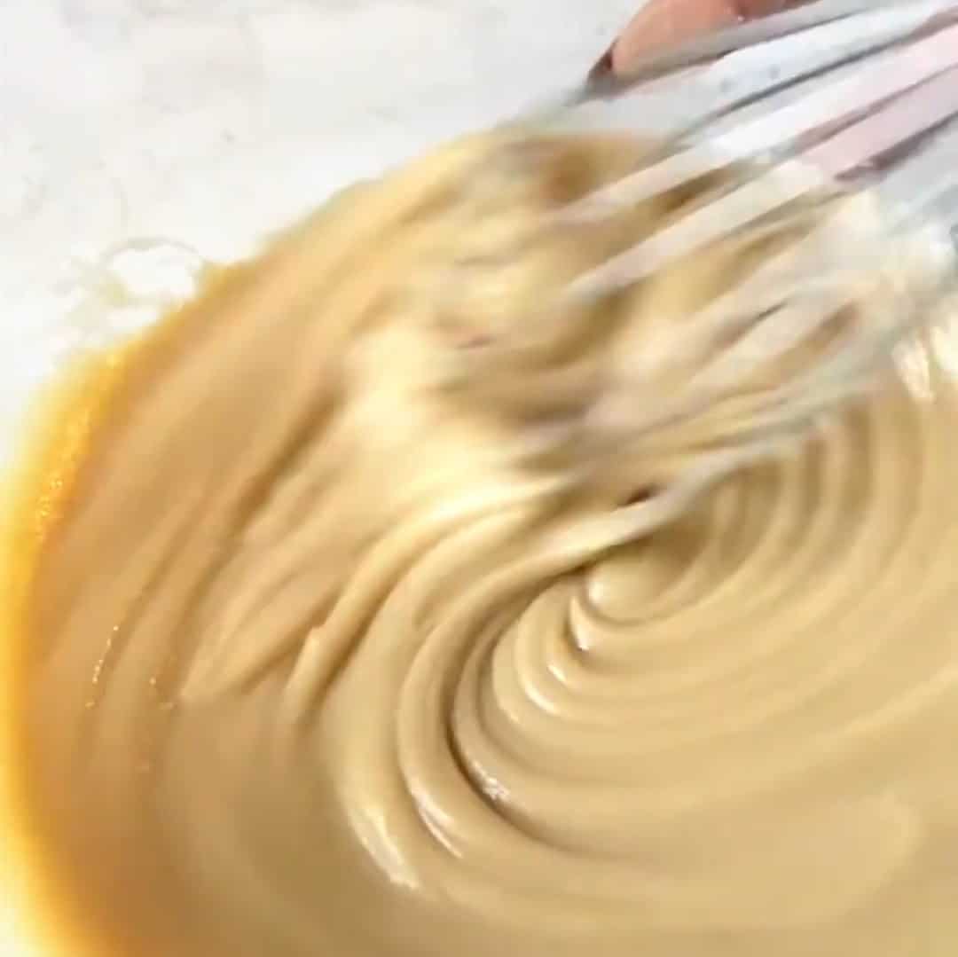 Whisking mixture for brownies with condensed milk.
