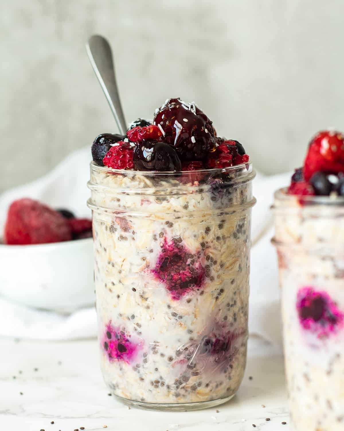 overnight oats with frozen strawberries in a jar