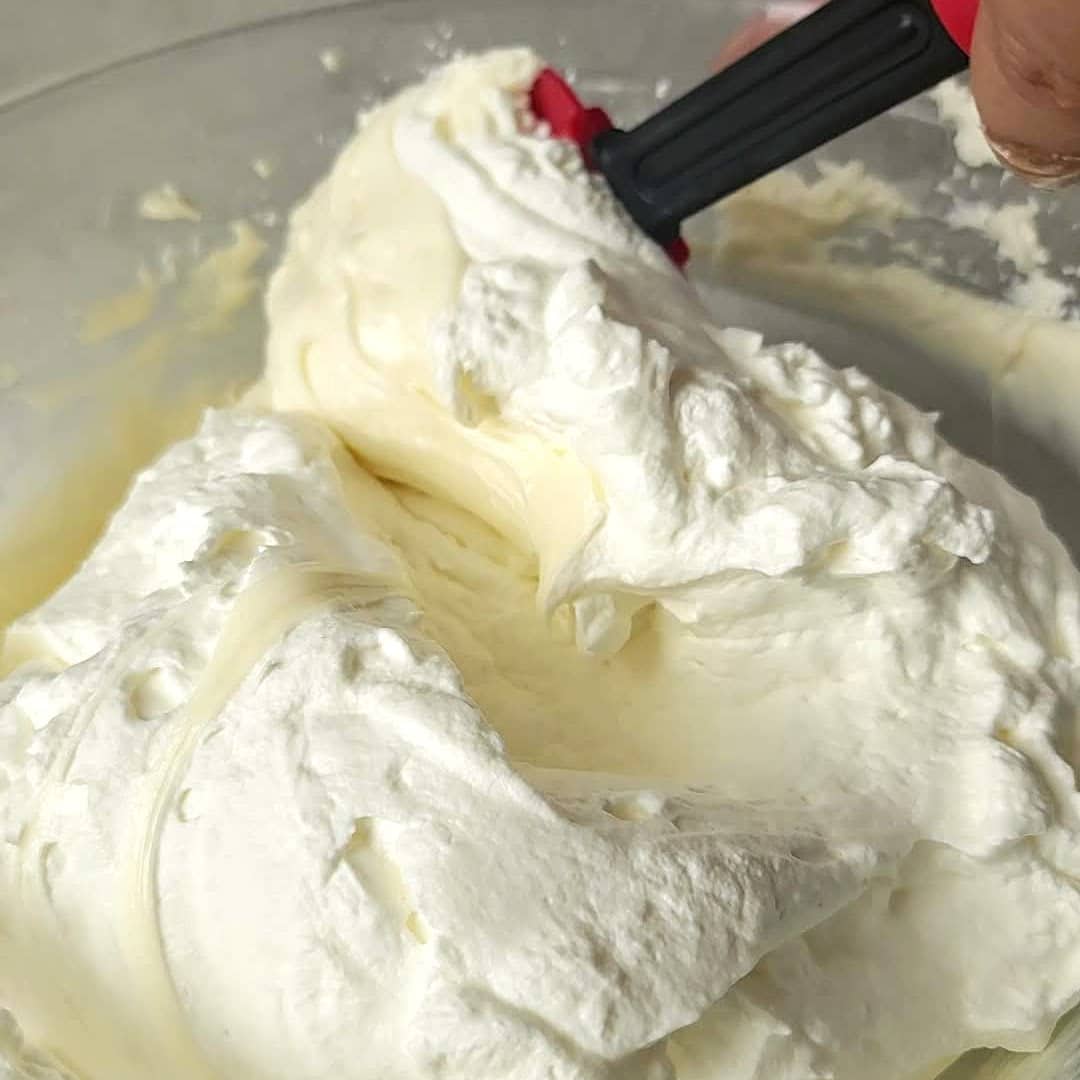 folding cream cheese mixture into whipped cream