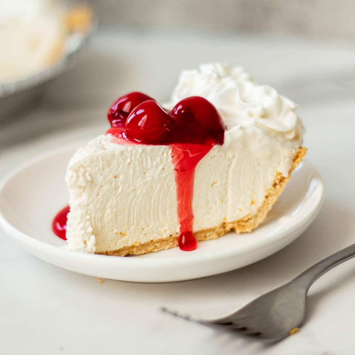 a slice of philadelphia no bake cheesecake with cool whip