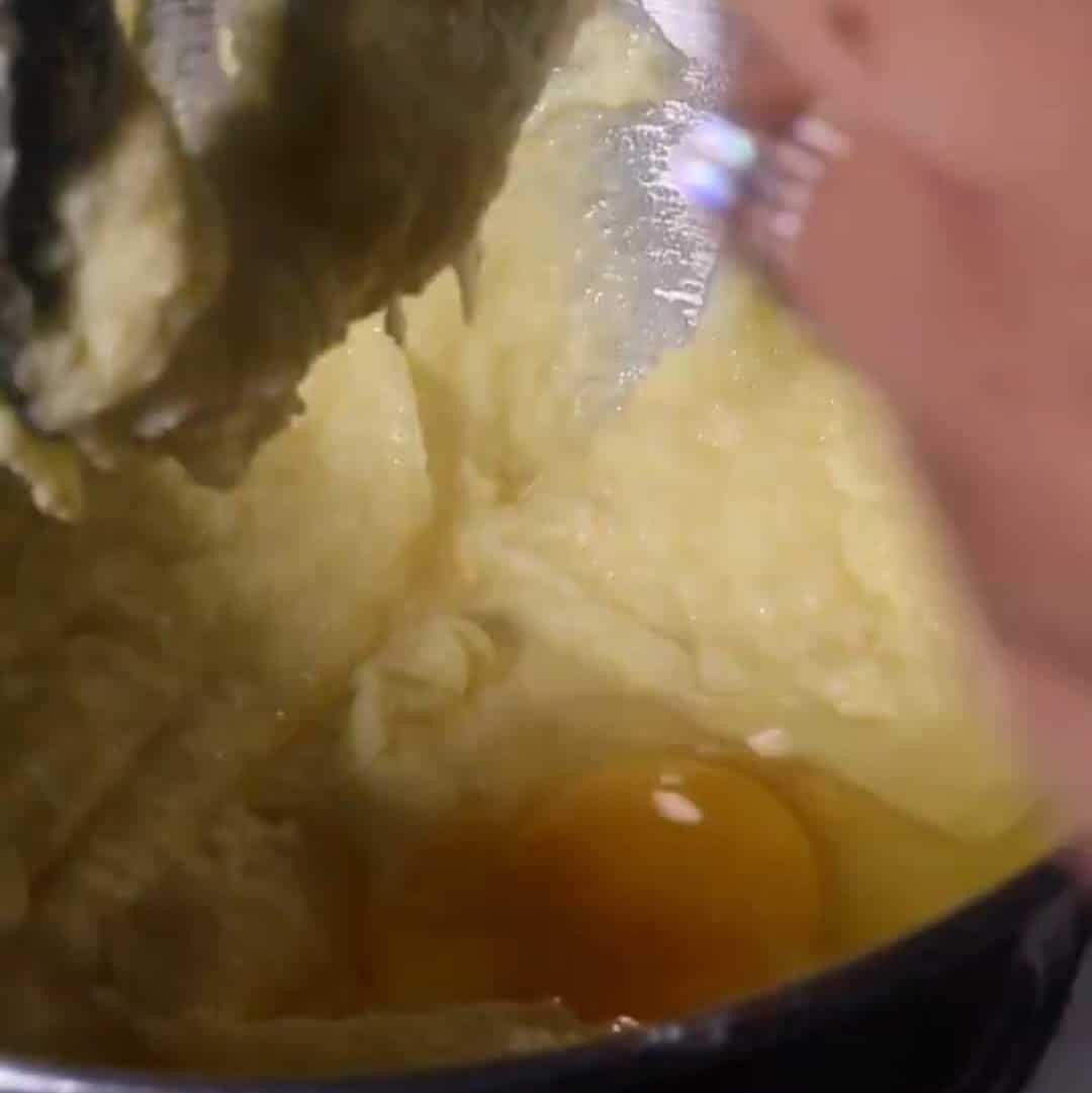 adding eggs to salted caramel kentucky butter cake batter